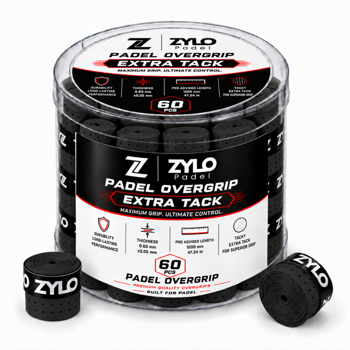 A clear plastic tub of ZYLO Padel Padel Overgrip Extra Tack grip tape, shown with two loose black grip rolls in front on a white background.