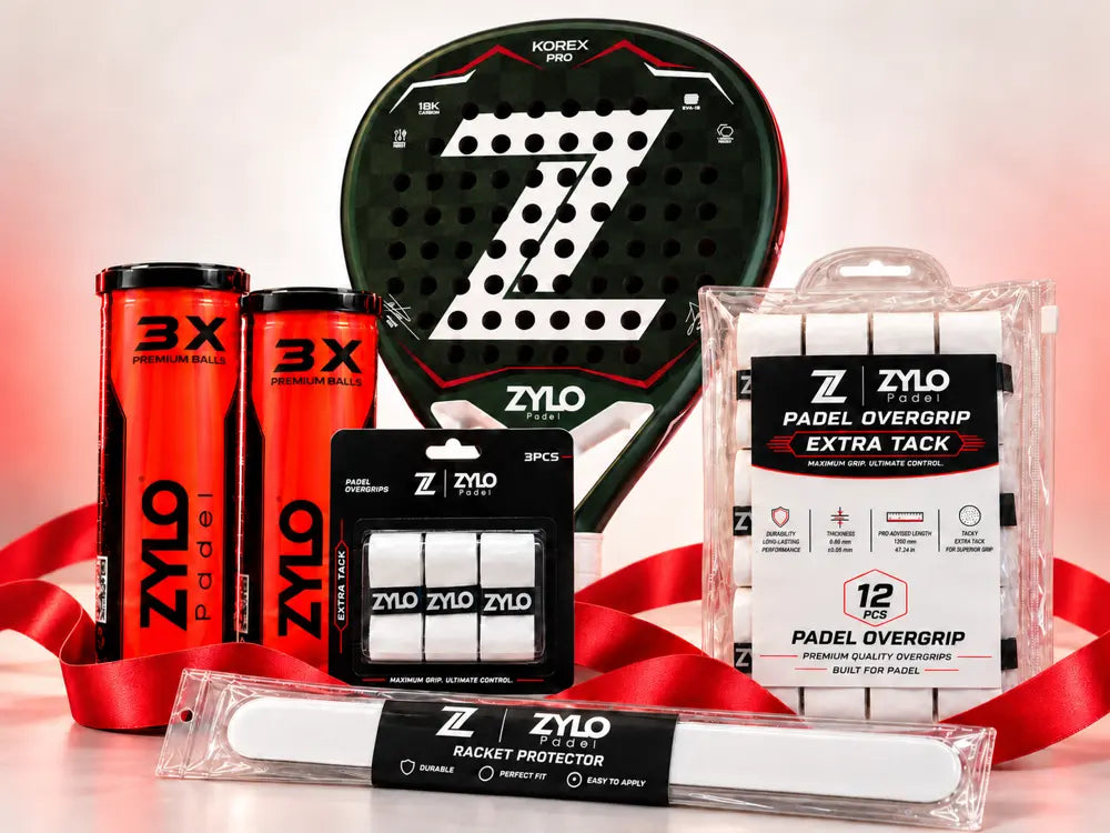 ZYLO KOREX PRO racket with padel balls, overgrips and a racket protector wrapped in red ribbon