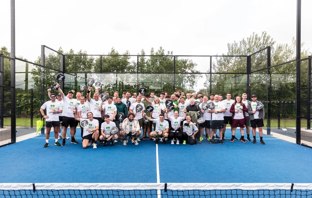 Players holding ZYLO rackets on an outdoor padel court